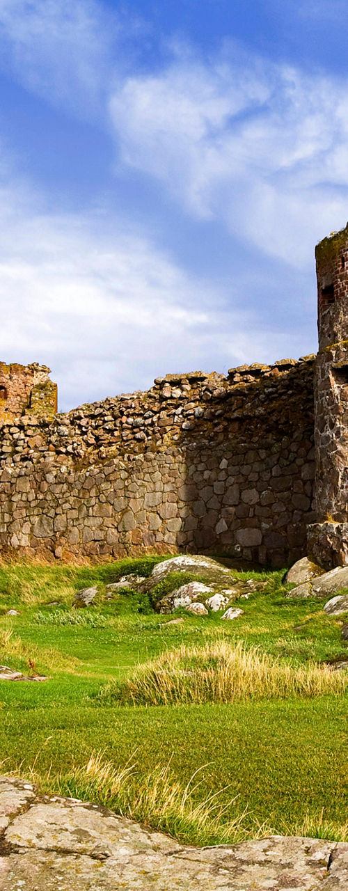 Historic stone ruins under blue sky