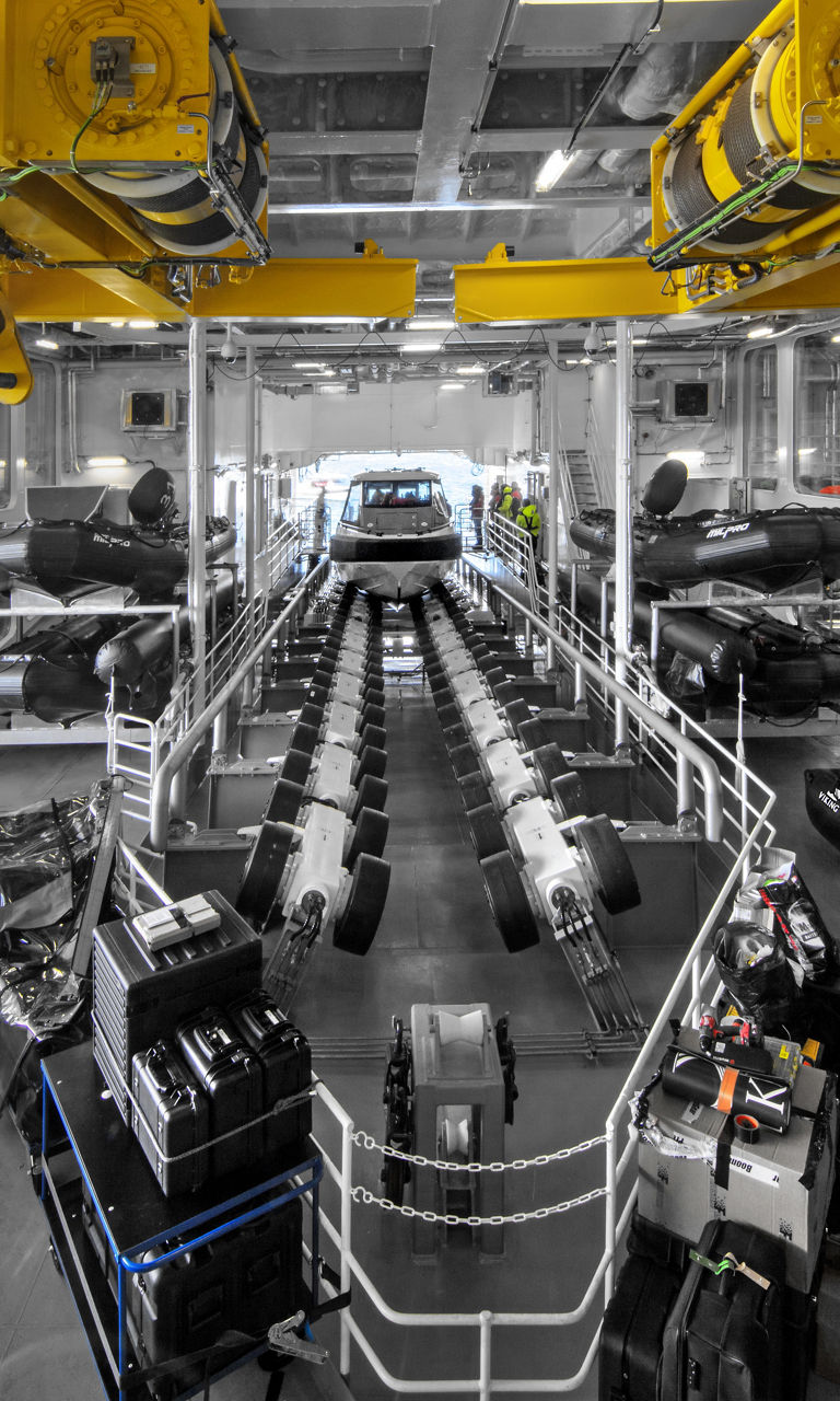 Industrial boat storage with yellow cranes
