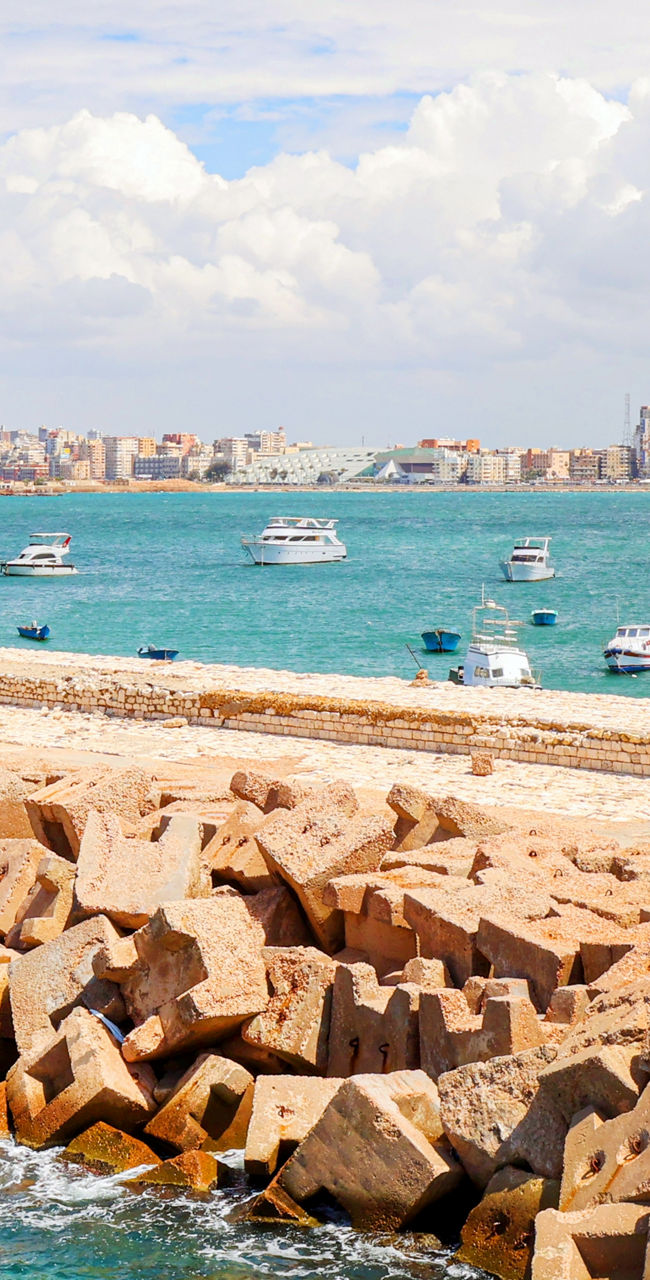 Scenic coastal view with boats and skyline