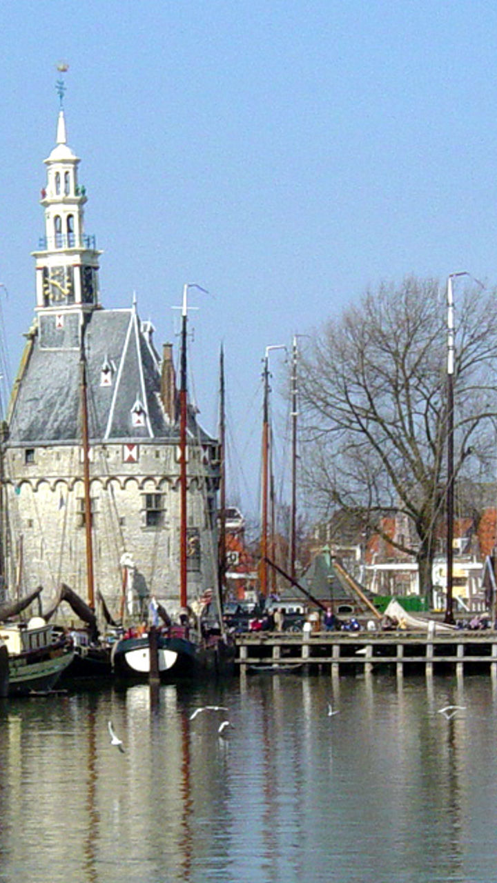Historic harbor with sailboats and tower