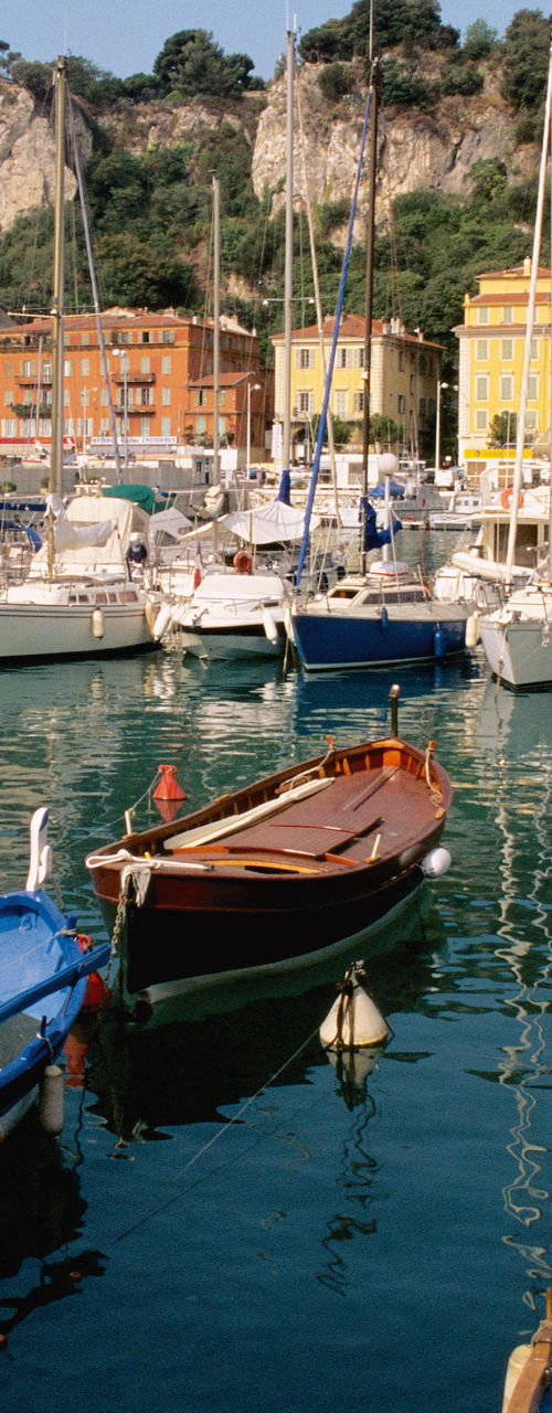 Colorful boats docked in scenic marina