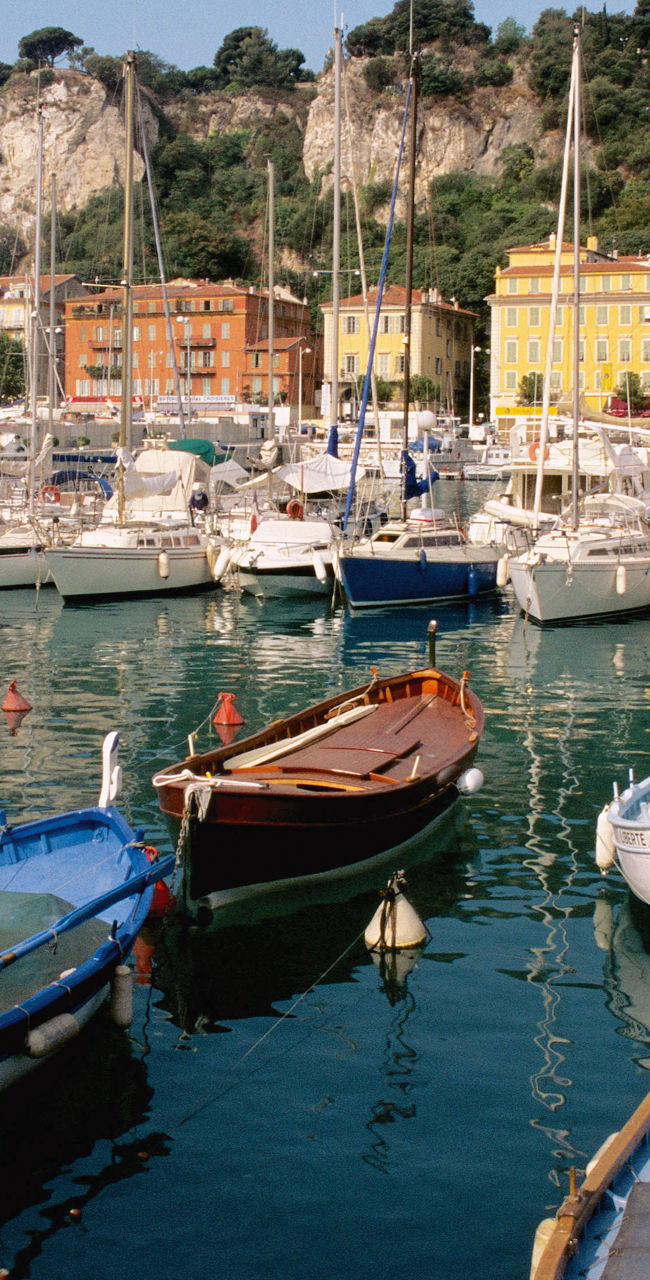 Colorful boats docked in scenic marina