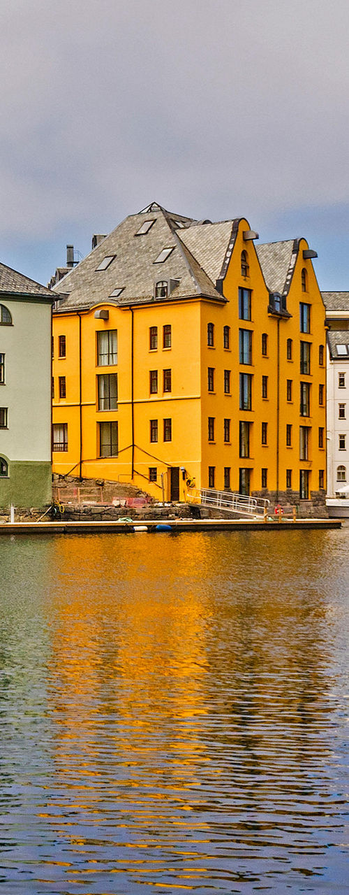 Colorful waterfront buildings and docked sailboat
