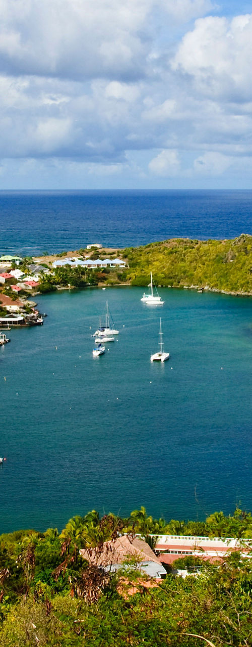 Scenic coastal harbor with sailboats
