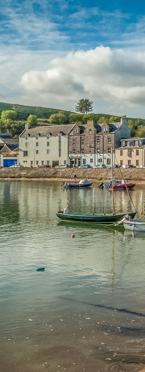 Scenic coastal village with boats and harbor