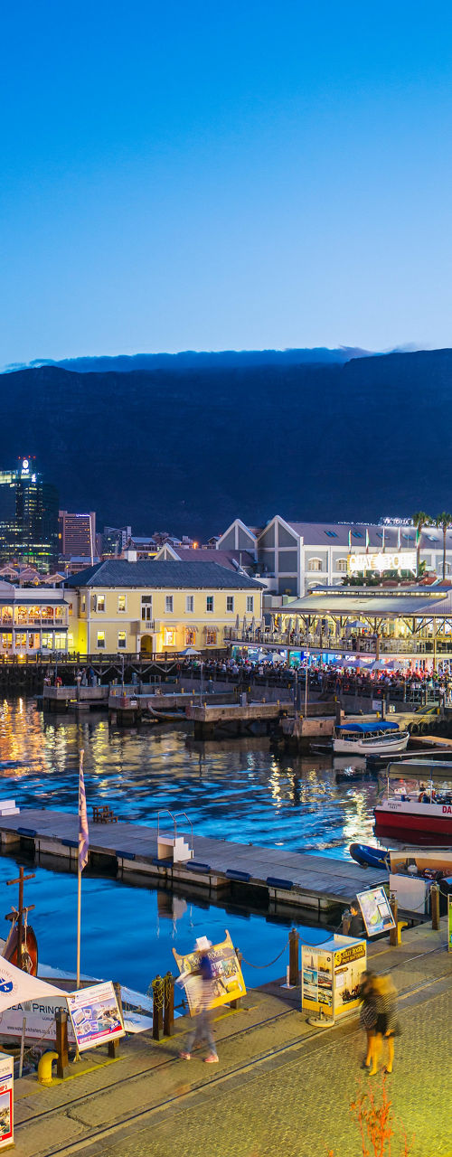 Cape Town waterfront with ferris wheel at dusk