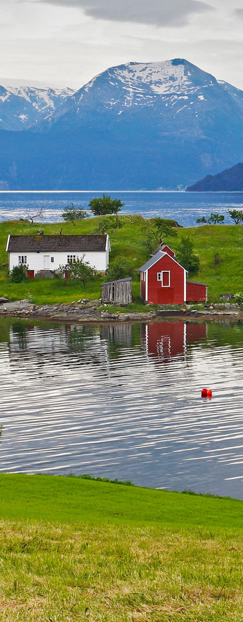 Scenic Island with Red Houses and Mountains