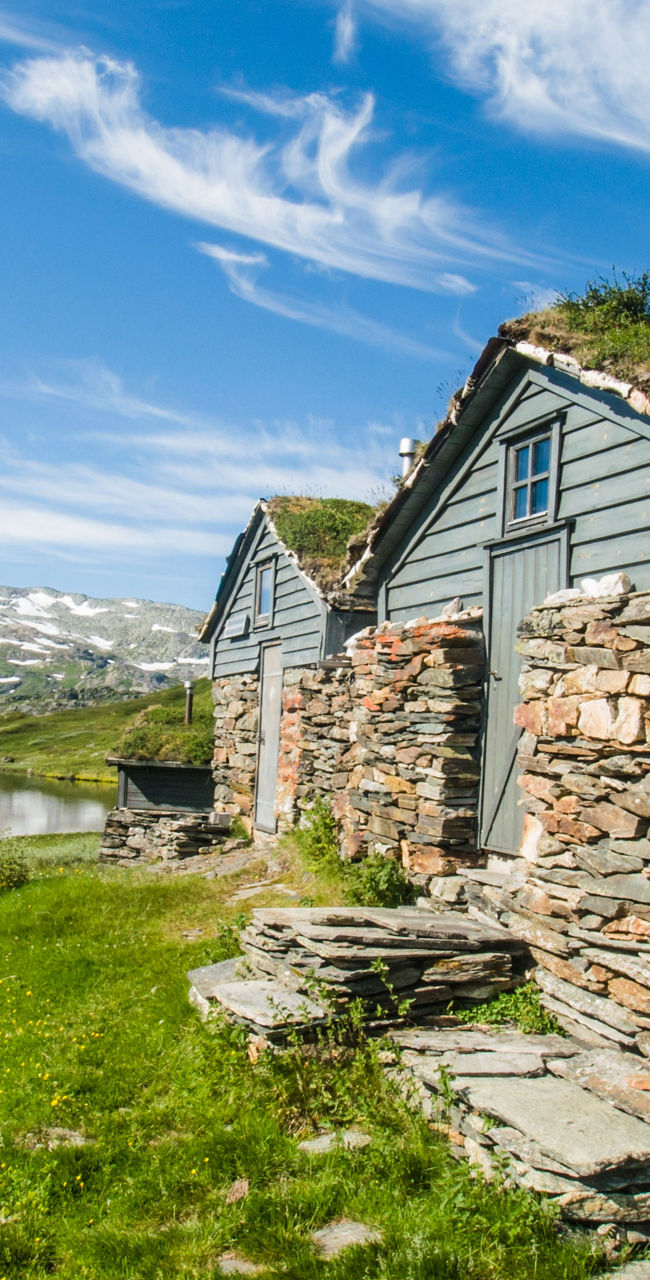 Rustic cabin by serene mountain lake