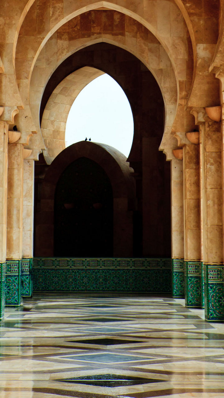 Elegant mosque corridor with intricate arches