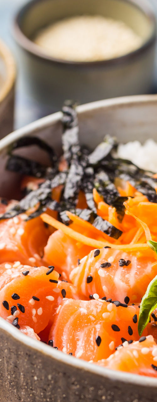 Salmon poke bowl with avocado and rice