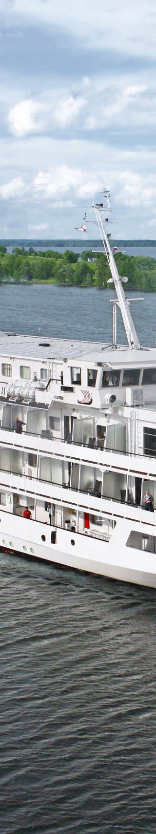 Luxury cruise ship on scenic river