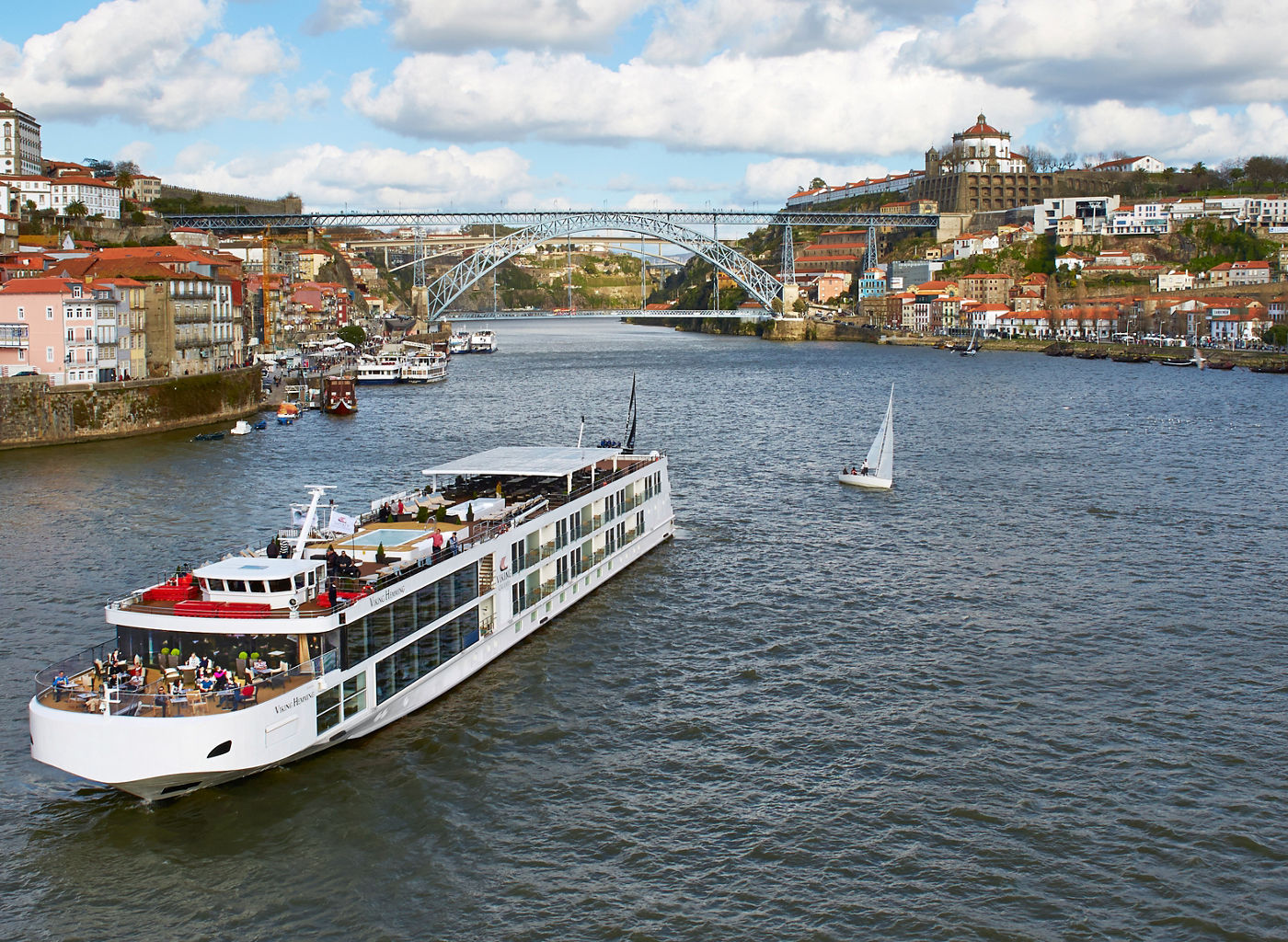 River cruise ship on scenic European waterway