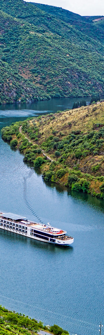 Scenic river cruise through lush valley
