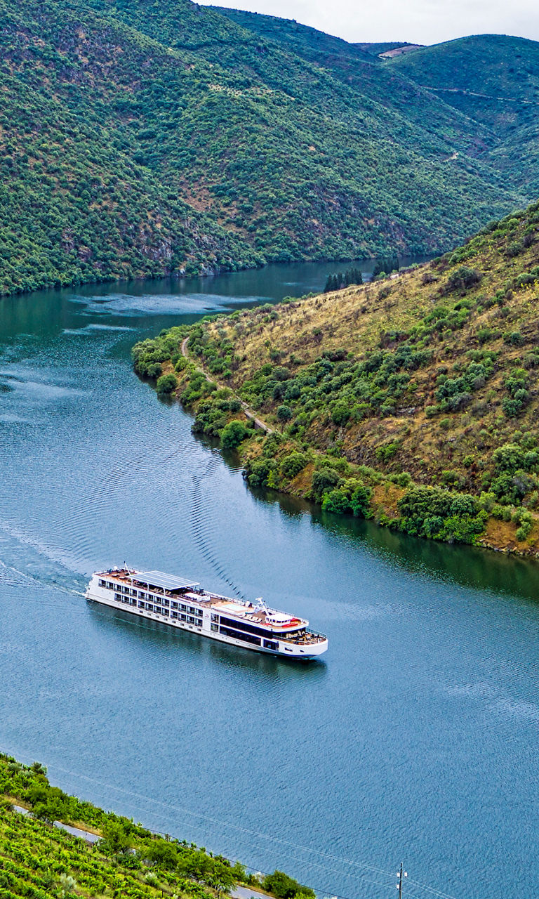 Scenic river cruise through lush valley