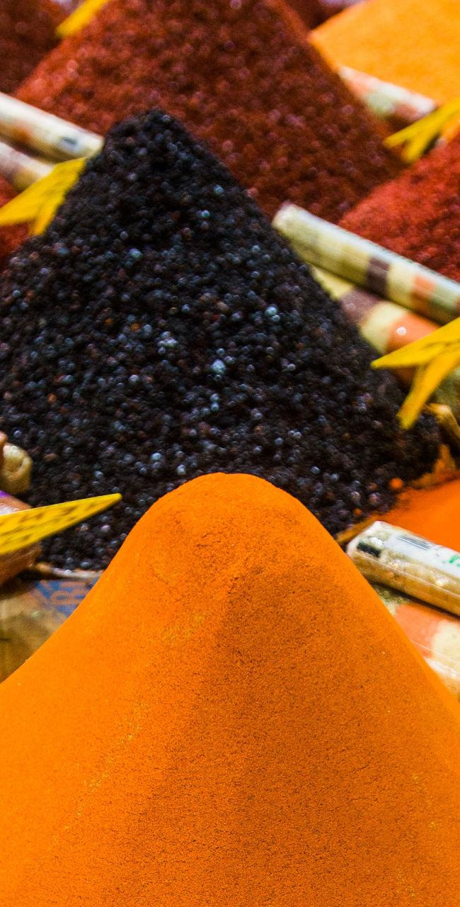 Colorful spice market with vibrant powders