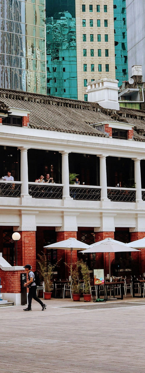 Historic red brick courtyard amid city skyscrapers