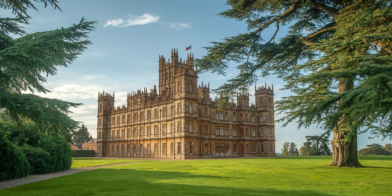 Historic castle surrounded by lush greenery