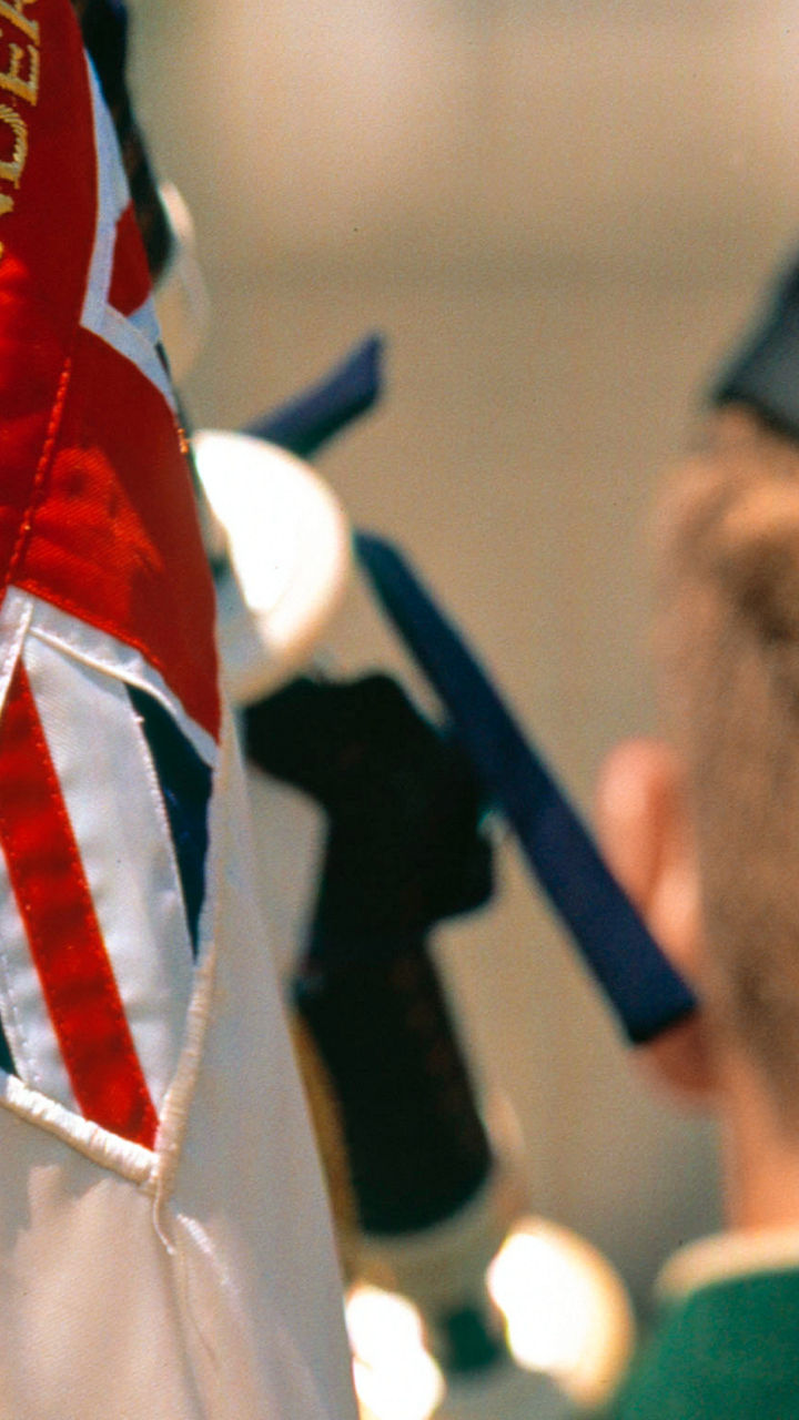 Scottish Highlander with ceremonial flag