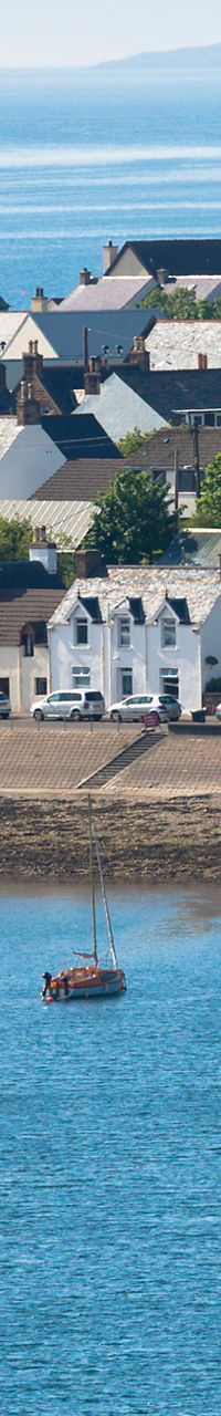 Coastal village with anchored sailboats