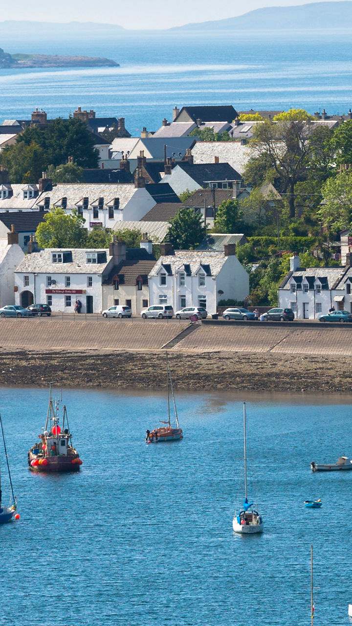Coastal village with anchored sailboats
