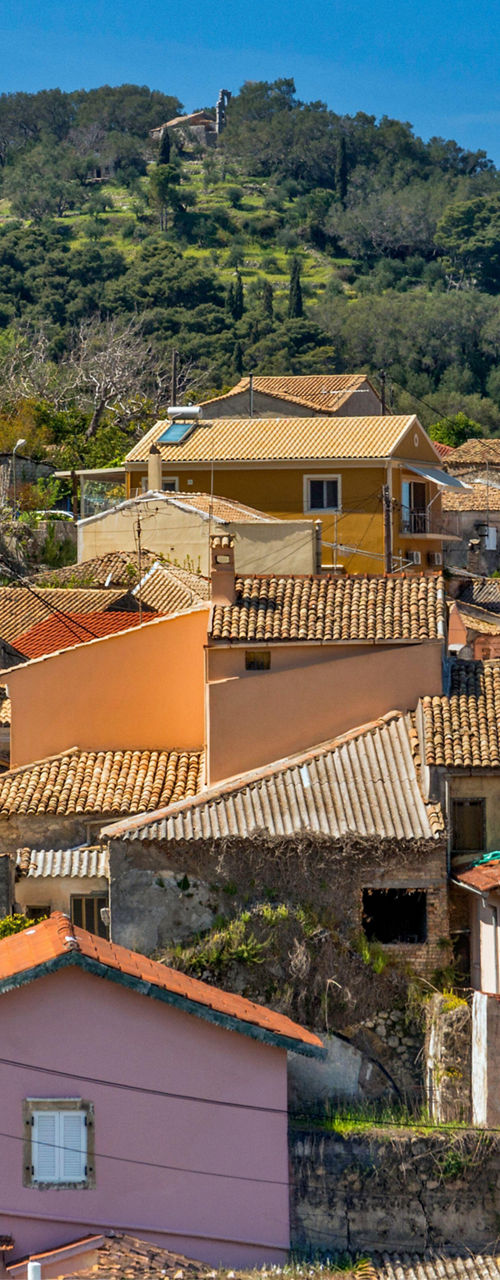 Colorful hillside village with tiled rooftops