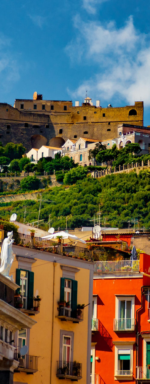 Colorful buildings with historic castle view