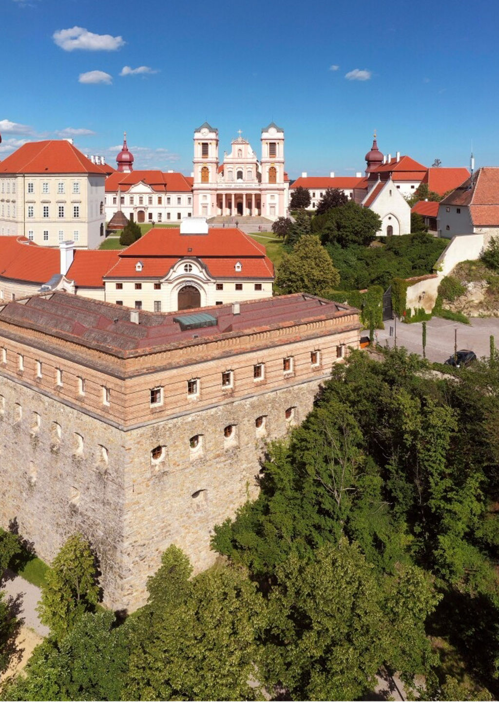 Historic hilltop monastery with red roofs