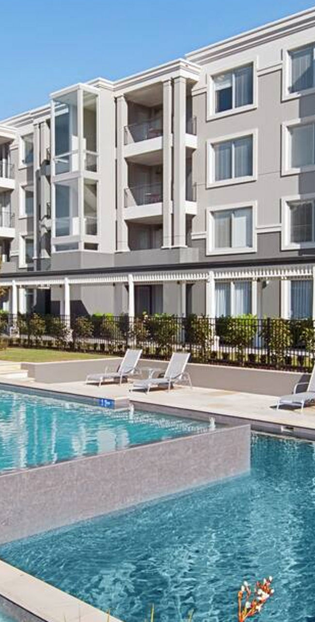 Modern apartment complex with outdoor pool
