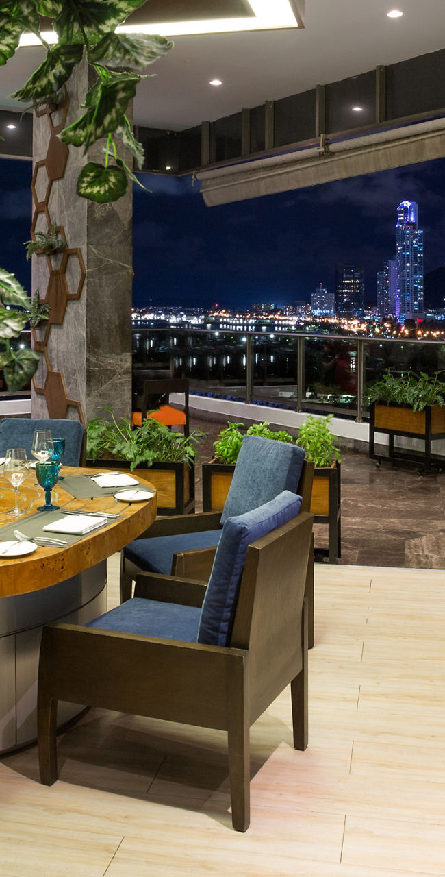 Modern dining area with city skyline view