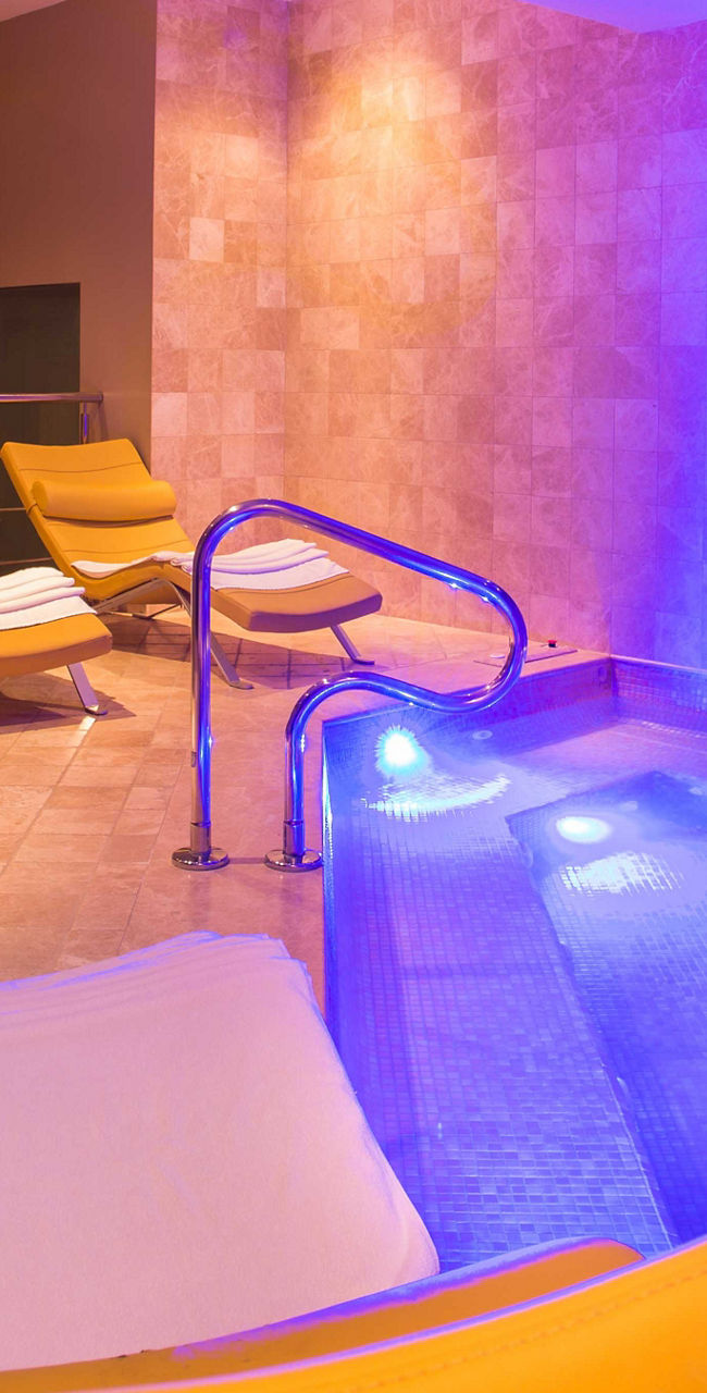 Luxury spa with illuminated pool area
