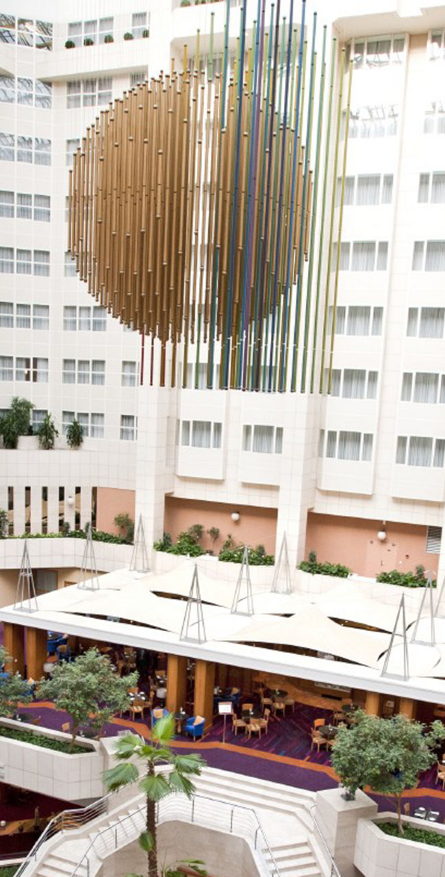 Modern hotel atrium with central sculpture