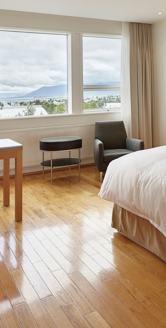 Modern hotel room with twin beds and view