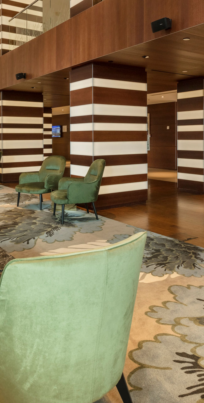 Modern hotel lobby with striped wood decor