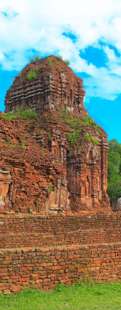 Ancient brick ruins in lush green landscape