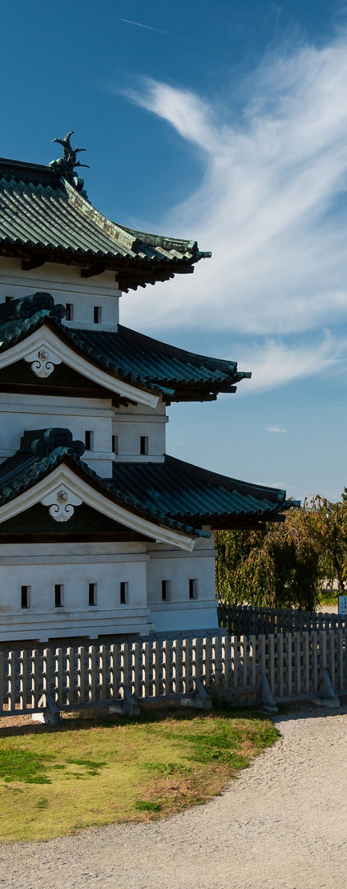 Traditional Japanese castle under clear blue sky