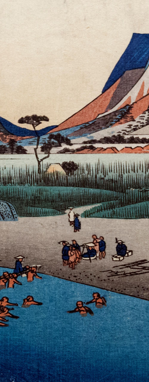 Traditional Japanese river scene with mountains