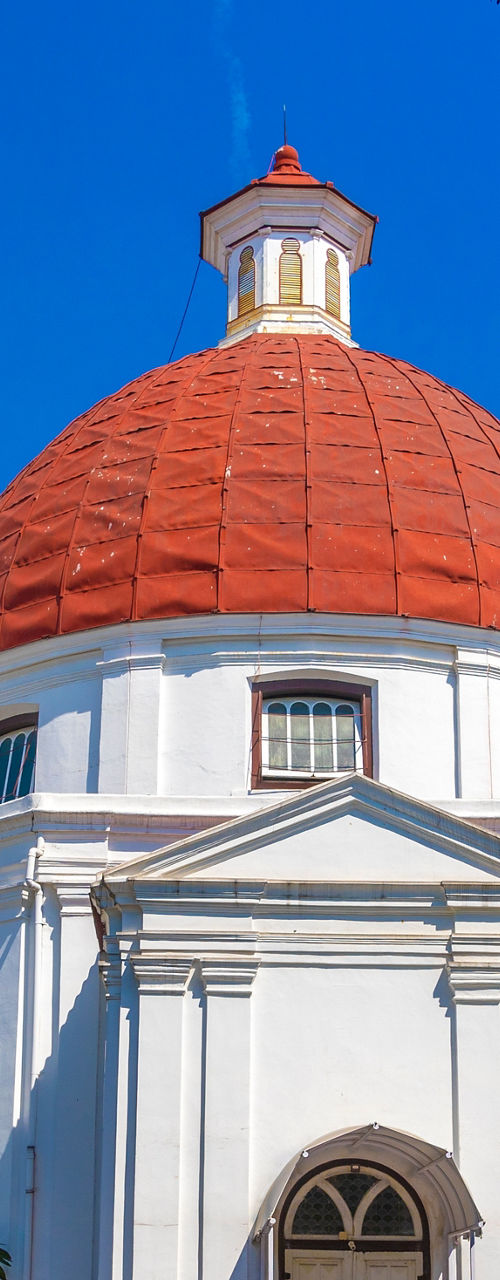 Historic white church with red dome