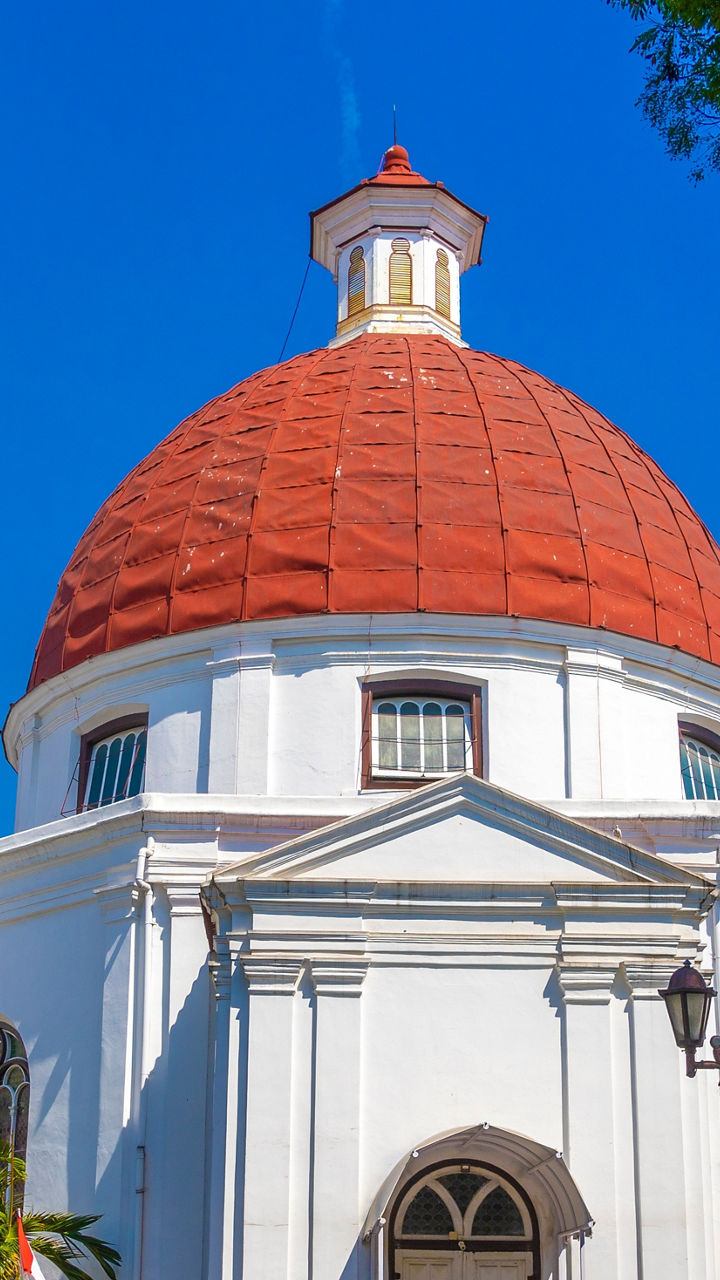 Historic white church with red dome
