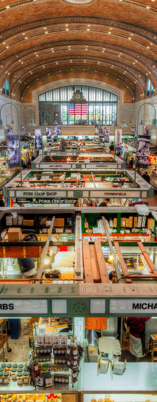 Vibrant indoor market with food stalls