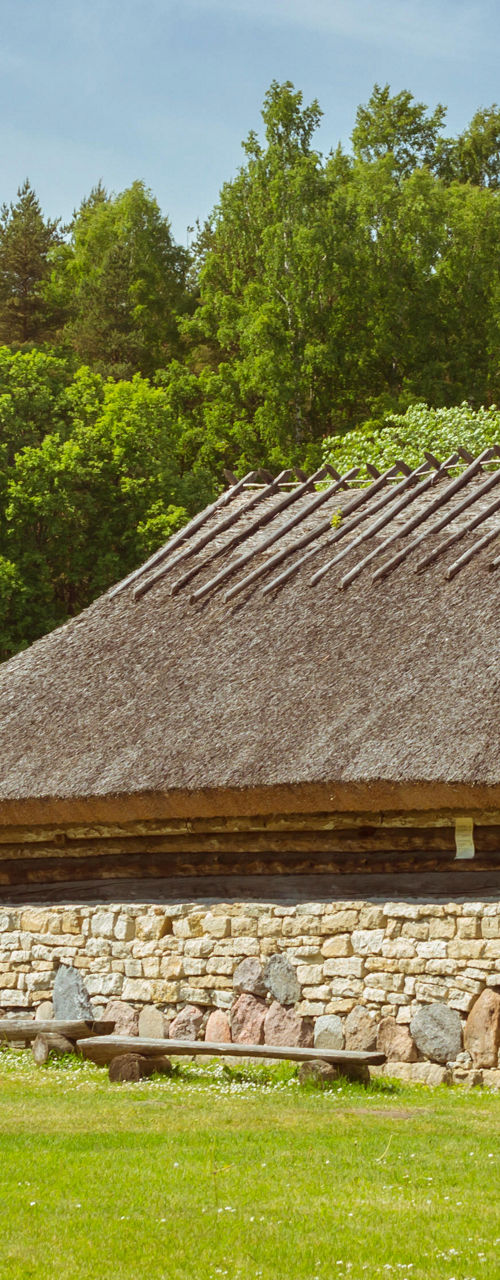 Rustic farmhouse with windmills in countryside