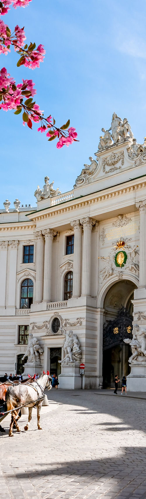 Historic Palace with Horse Carriage Scene