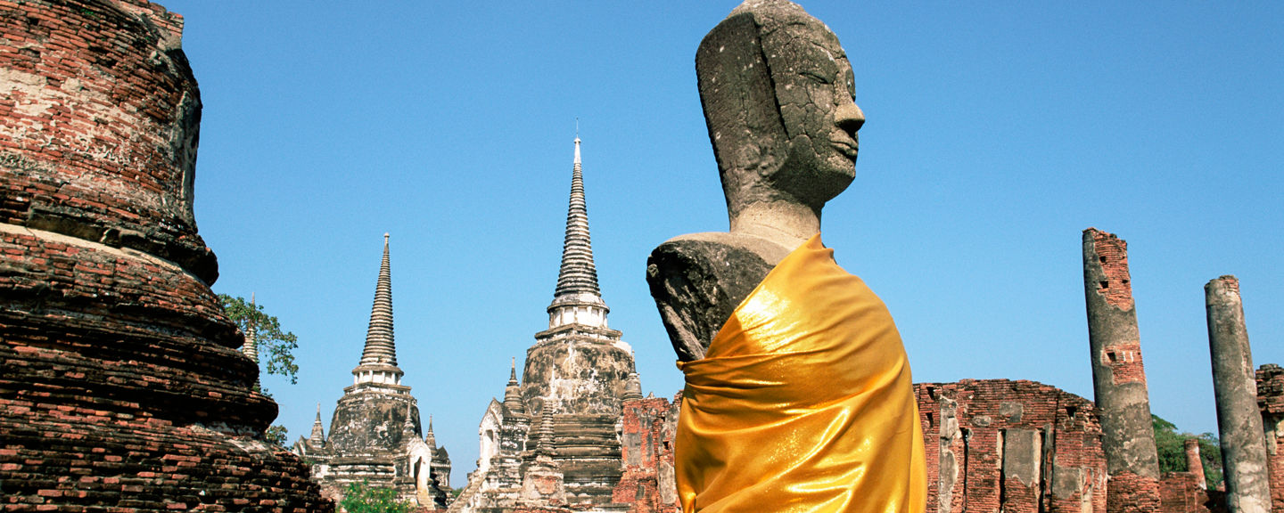 Ancient Buddha statue in historic temple ruins