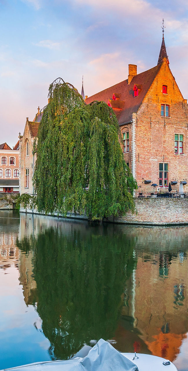 Scenic canal view in Bruges at sunset