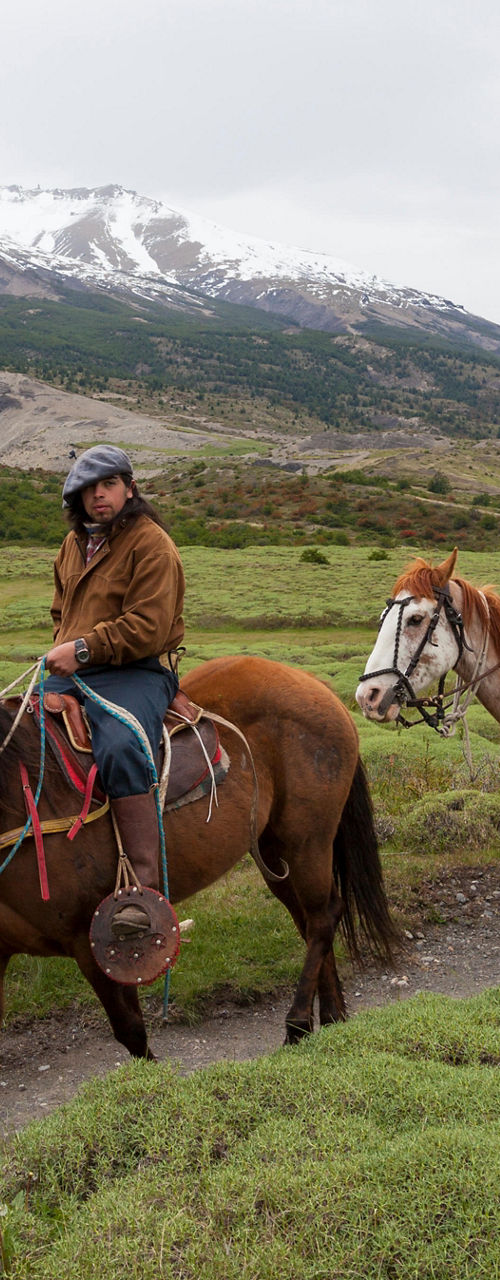 Group horseback riding in scenic mountains