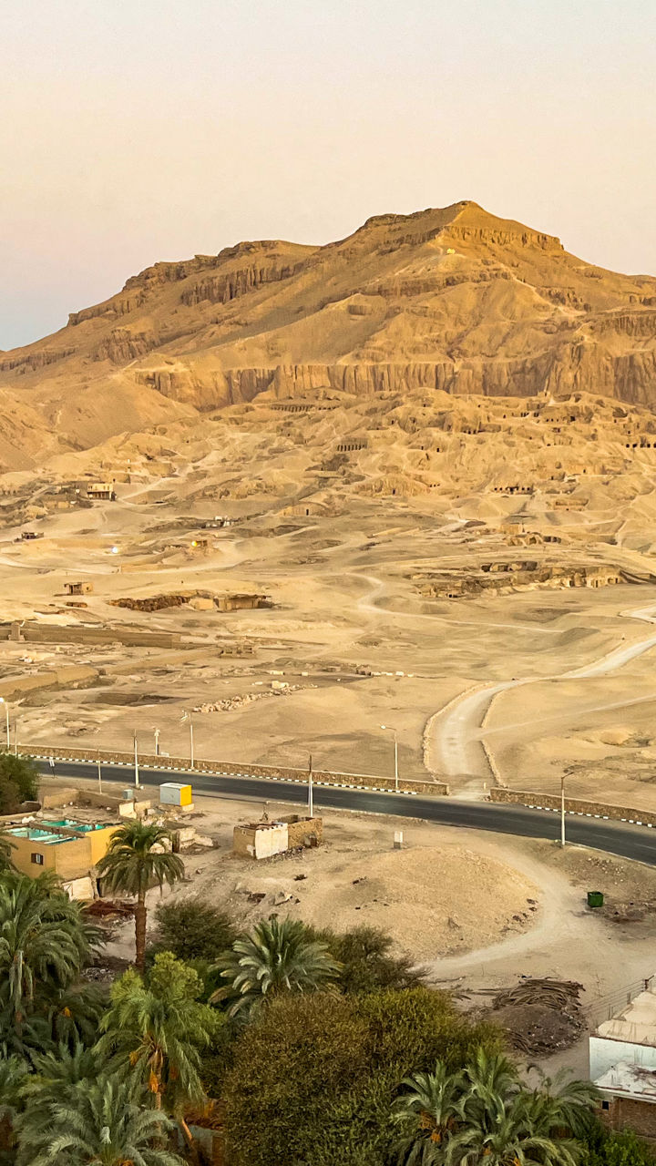 Colorful hot air balloon over desert village