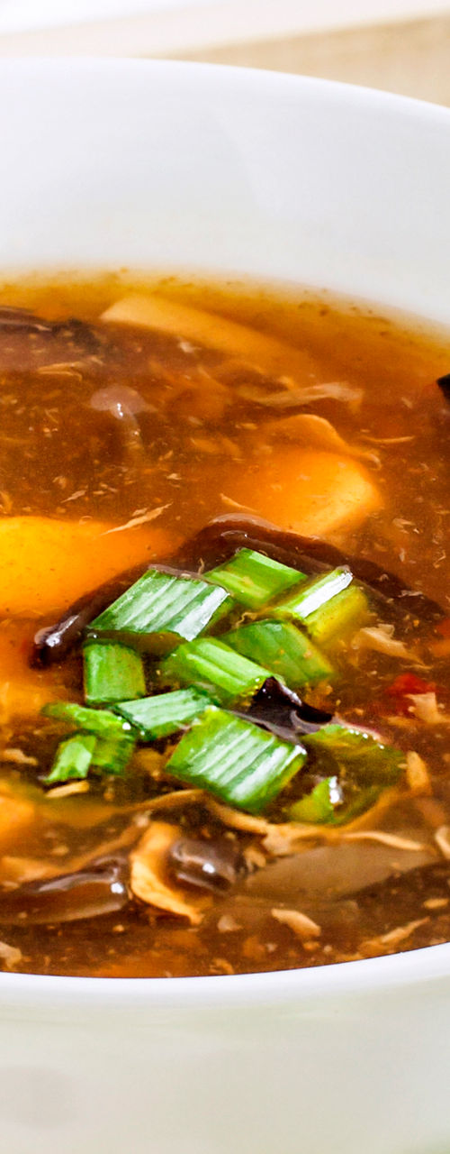 Hot and sour soup in white bowl