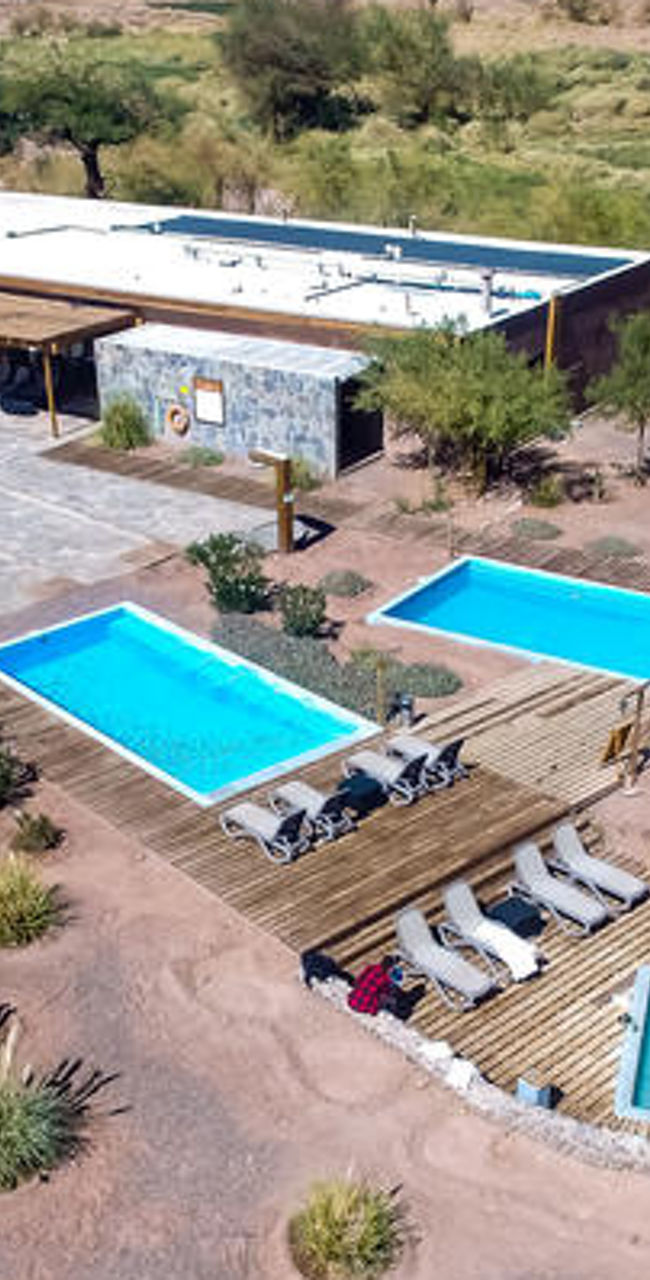 Aerial view of resort with pools and spa