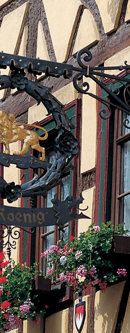 Traditional European Building with Ornate Sign