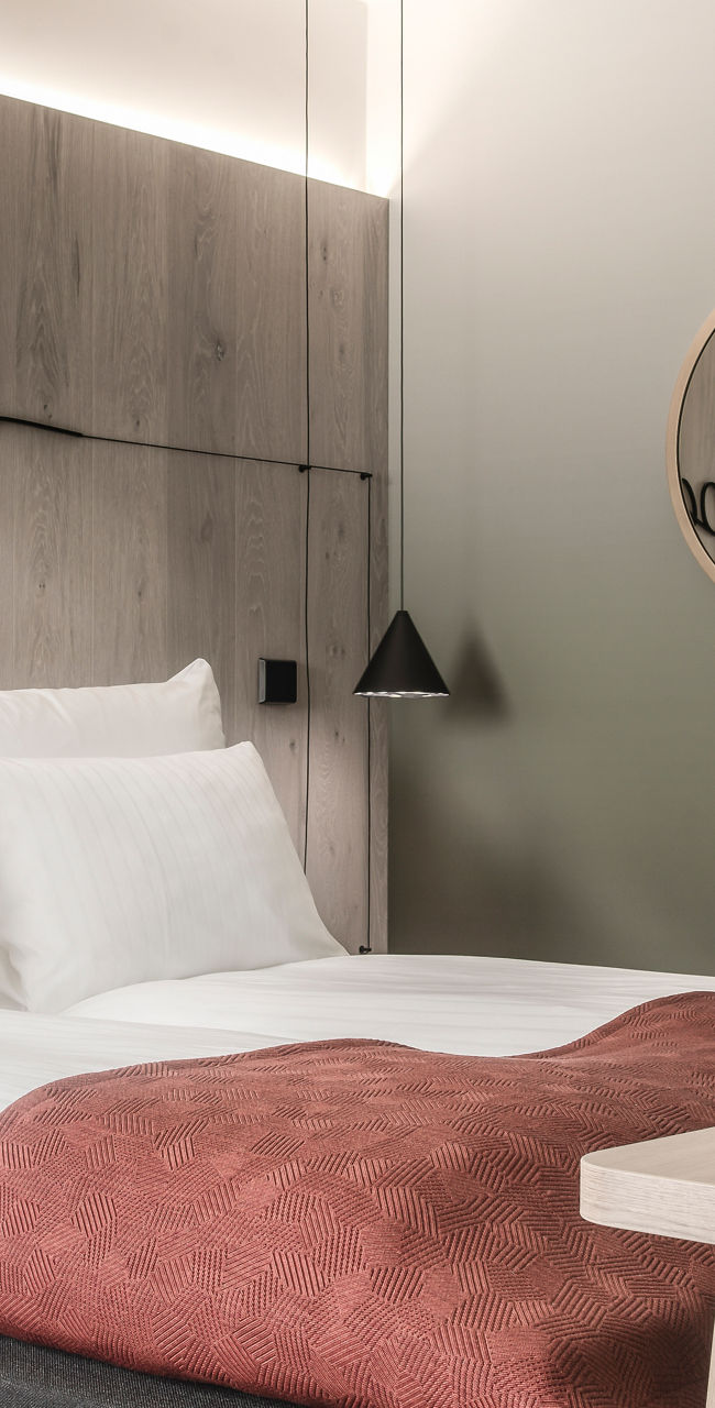 Modern hotel room with cozy decor