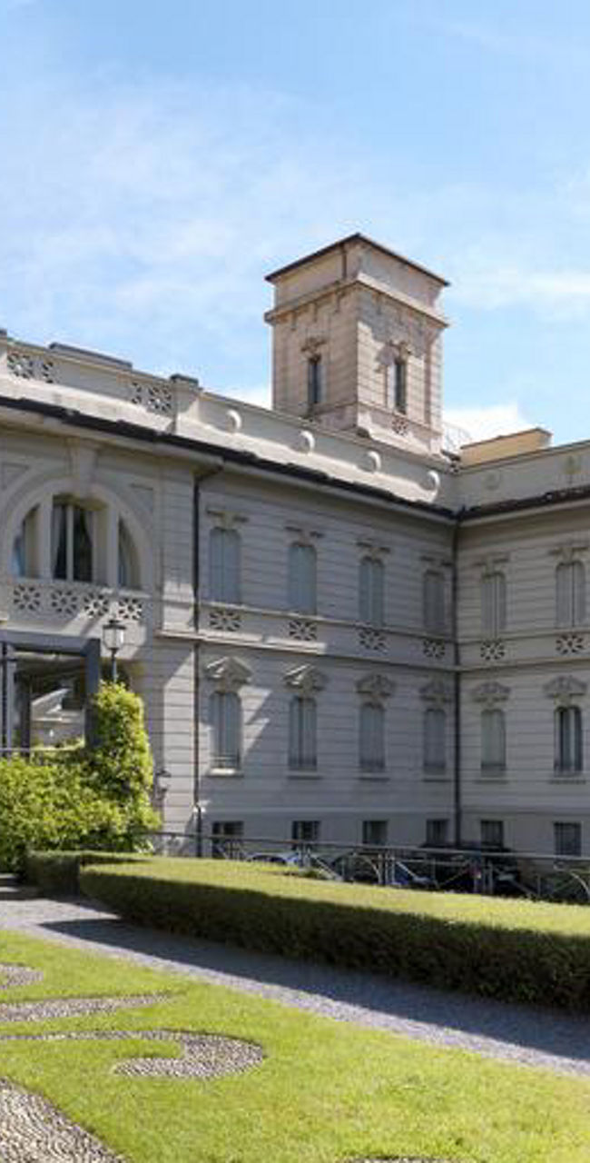 Elegant historic building with lush garden